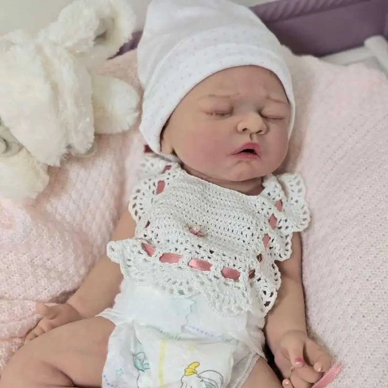Realistic full silicone reborn doll (takes a bottle and wets her diaper