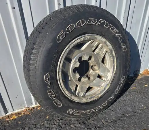 Goodyear Wrangler P225/75R15 Tire And Toyota Rim