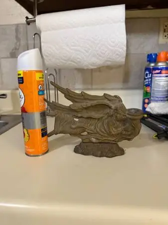 Brass angel with candle stick holder