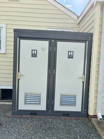 Outdoor portable toilet with two private stalls
