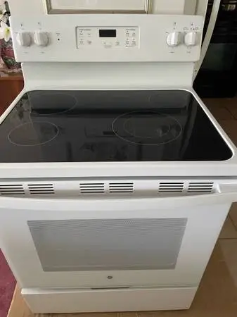 #### ELECTRIC WHITE GE STOVE WITH SELF CLEANING  ####