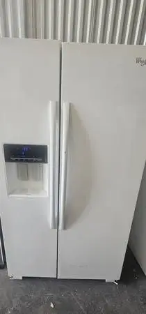 Whirlpool dent & ding side by side refrigerator plugged in and cold
