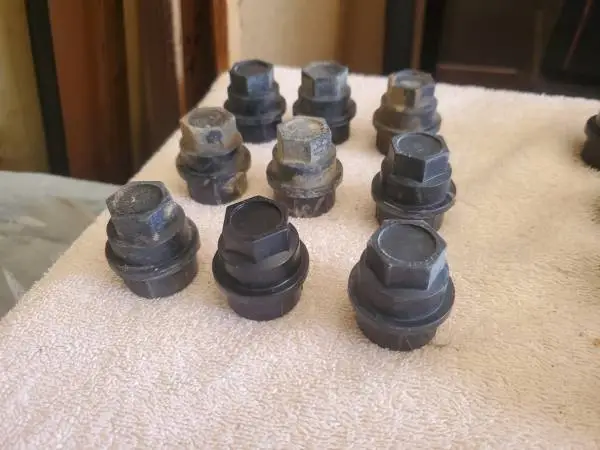 Black plastic wheel lug covers
