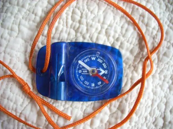 Compass with whistle on lanyard