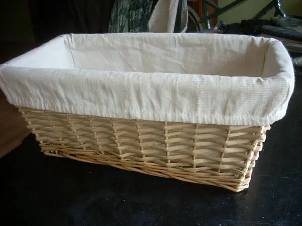 Wicker storage basket with white cloth liner