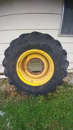 CASE backhoe rear tire and wheel.