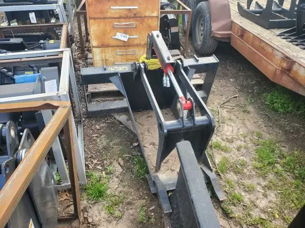 New skid steer stump bucket with grapple