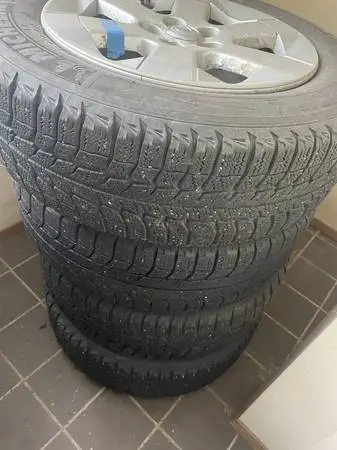 4 wheel set  15” toyota studless winter tires on mag rims with covers