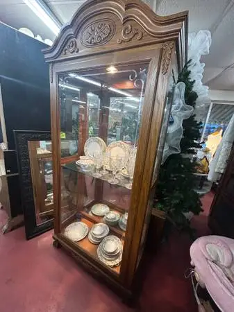 Light oak curio cabinet