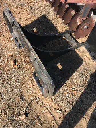 Skid steer rock digger