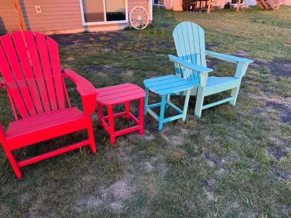 Two maintenance free deck chairs with two tables