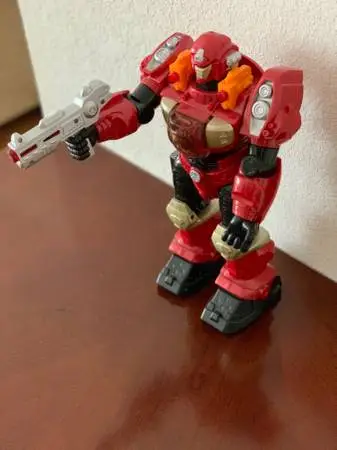 Toy Robot talks and walks lights up as well Gun can be removed