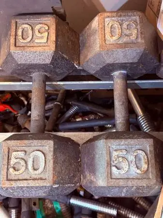 PAIR OF STEEL 50 LB. DUMBBELLS