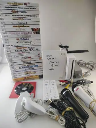 Nintendo Wii Bundle with 30 games & 2 Microphones
