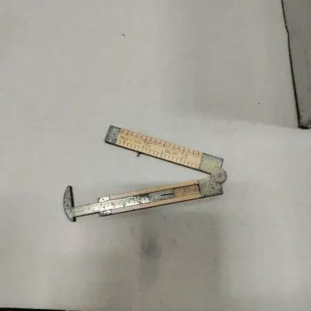 The CS company number 36 folding brass ruler