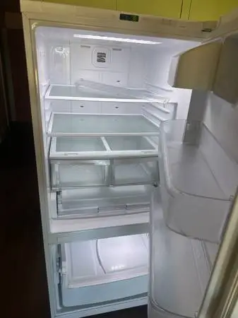 Top refrigerator bottom freezer