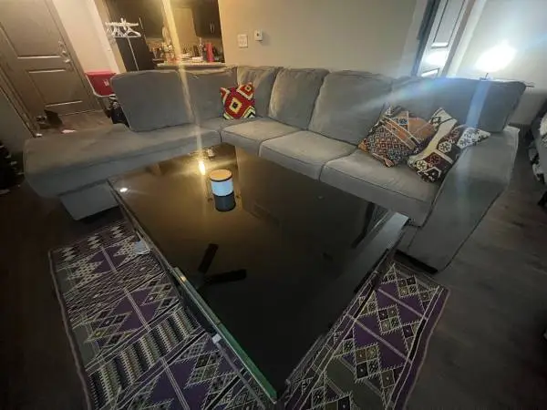 L Couch and glass coffee table