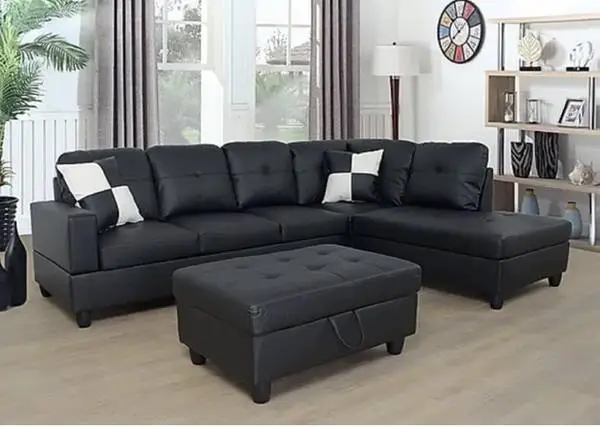 Black leather sectional couch and ottoman
