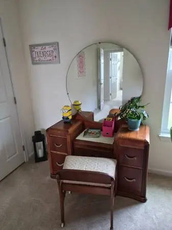 dresser with mirror and chair
