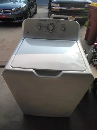 GE washing machine with a large tub, white in color