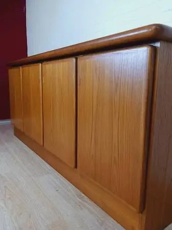 Mid Century Danish, Plinth Based Sideboard In Teak With Sliding Doors