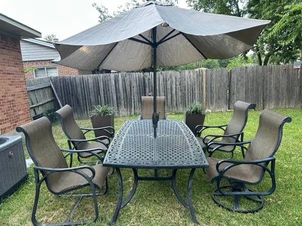Huge 8 foot patio table with five chairs