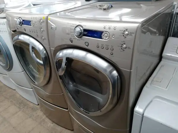 ★GE Profile tan front load washer and dryer set on pedestals