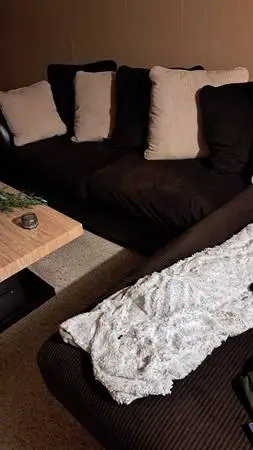 Brown and tan Leather couch and tables