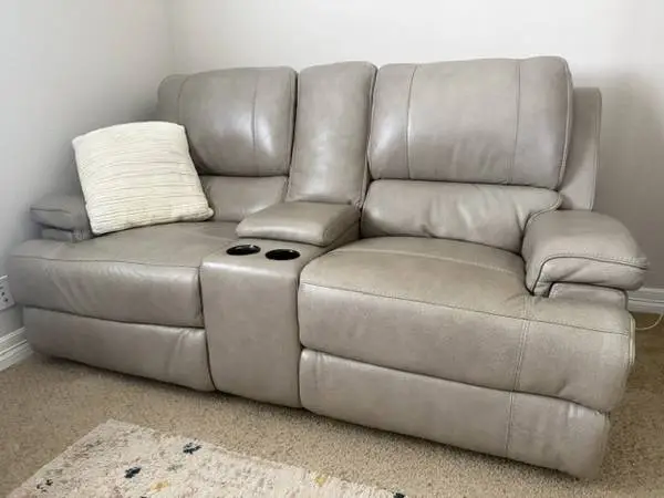 Dual power reclining leather loveseat