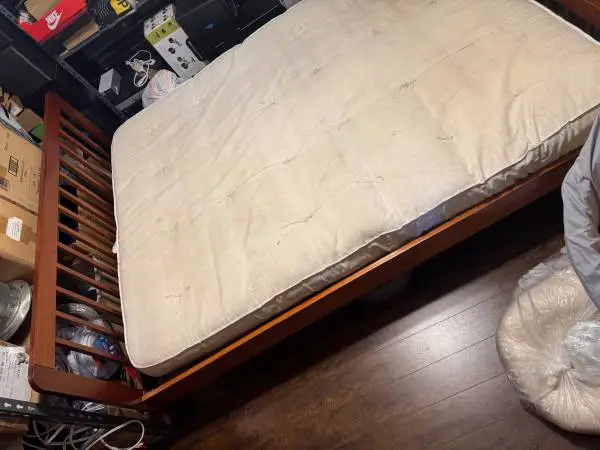 Queen bed solid wooded frame and mattress included ,good as a starter