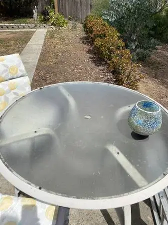 Patio table -4 foot round tempered glass with 2 padded chairs