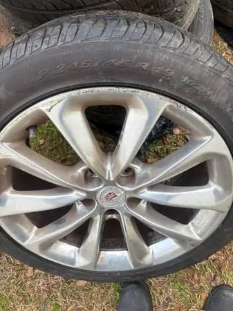 19IN CADILLAC RIMS W/ 3 GOOD TIRES FOR SELL
