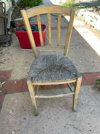 Rustic wooden chair with woven seat