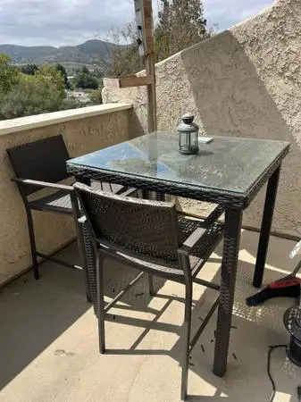Outdoor wicker chairs and table with Glass top