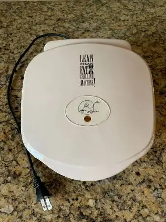 GEORGE FOREMAN GRILLING MACHINE