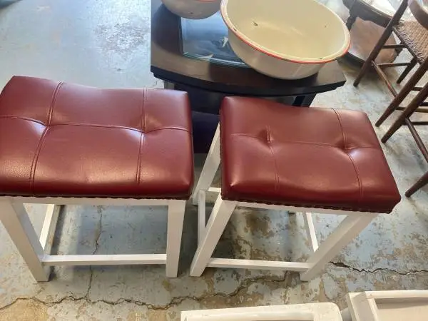 2 small leather bottom stools
