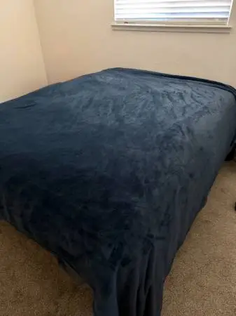 Queen size bed with a metal frame