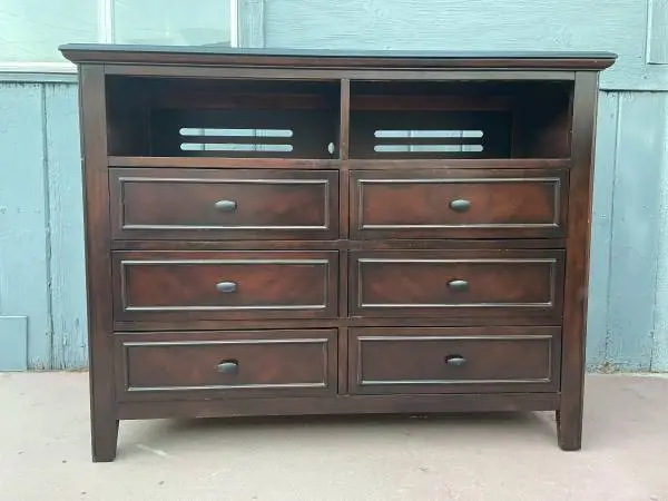 Solid wood long dresser in good condition all drawers open just fine