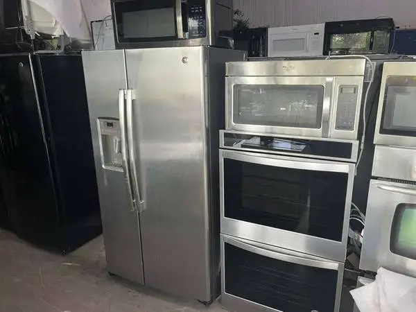 stainless steel side by side kitchen appliance package.