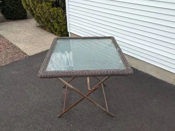 GLASS TOPPED WICKER FOLDING TABLE