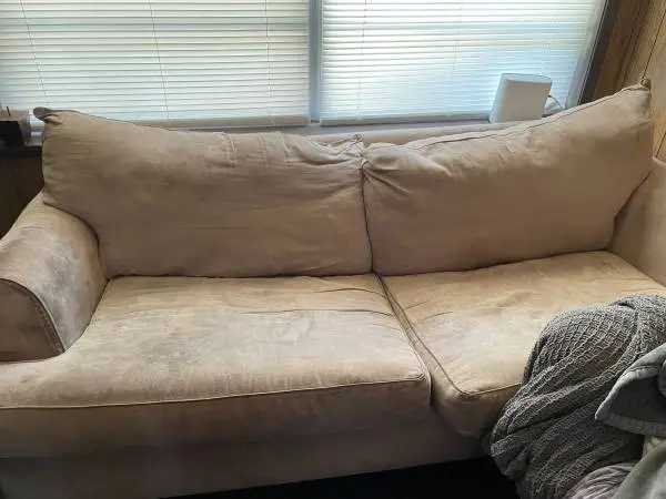 Soda with full size bed inside