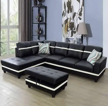 Black and white leather sectional couch and ottoman