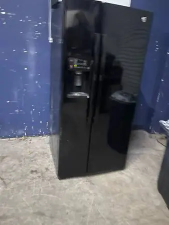 Black GE smooth finish side by side fridge