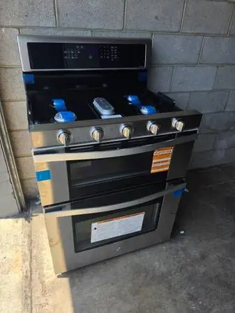 New whirlpool stainless steel gas stove with double oven
