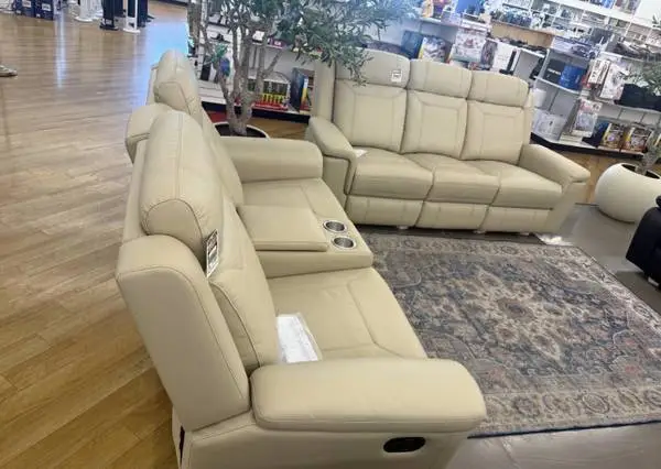 Beige leather fully reclining sofa and love seat
