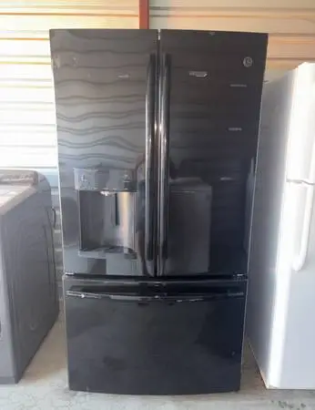 Black GE Refrigerator And Freezer