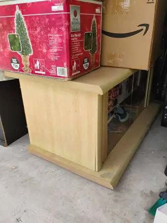 Beige or Tan color T.V. stand, USED in Good condition.