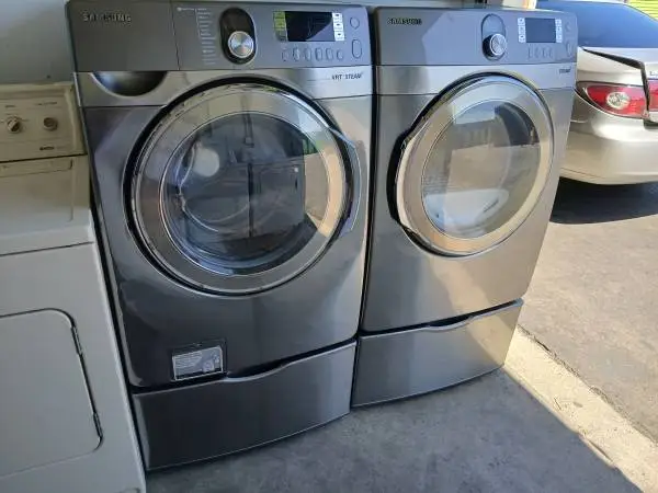 Samsung steam Grey front load washer and gas dryer