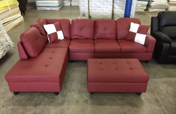 Red leather sectional couch and ottoman