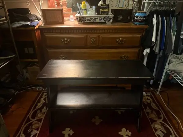 Black Bench with Lower Shelf  Solid black bench with a lower shelf for storage o
